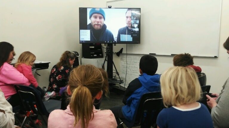 A classroom participates in a live video call with researchers in Antarctica