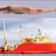 A collage of two pictures showing an Antarctic Dragonfish on top, and the R/V Gould at sea.